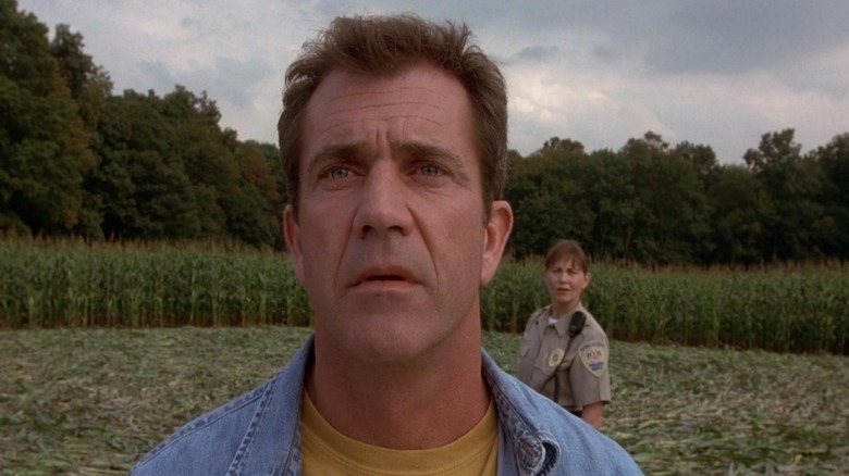 Graham (Mel Gibson) stood in a crop circle in Signs