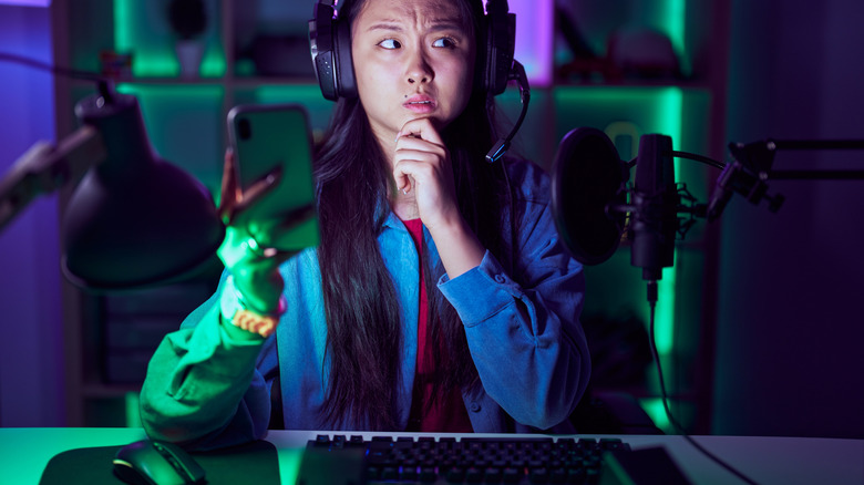 A gamer reacting to offscreen noise