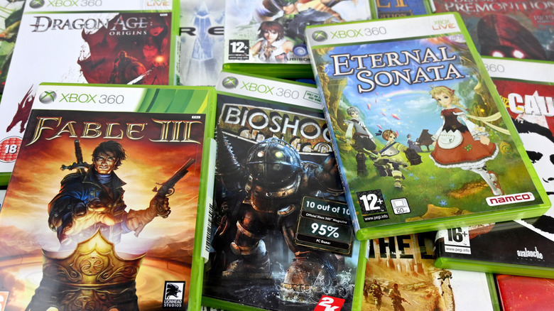 A collection of Xbox 360 game discs