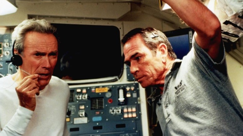 Frank and Hawk standing next to each other in the spaceship
