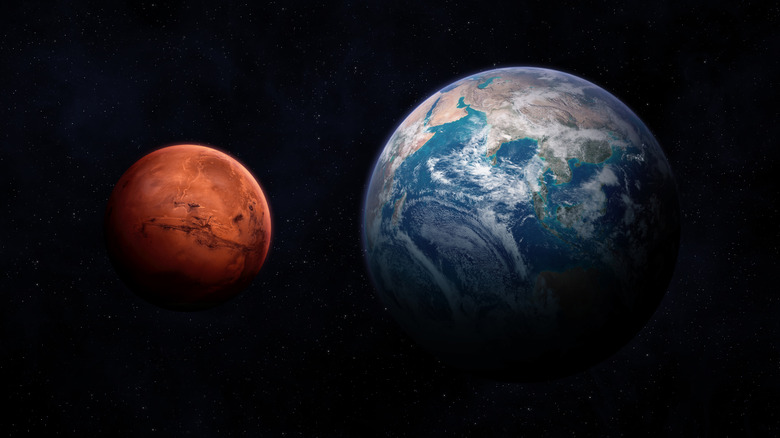 An illustration of Earth and Mars, as seen from space.