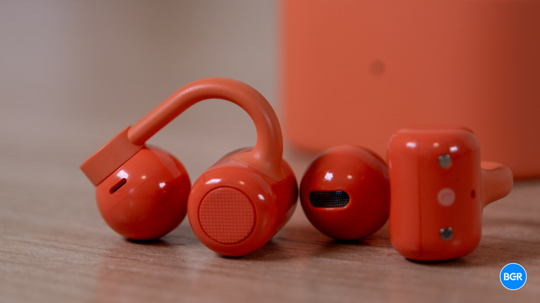 CMF Clip Pro earbuds on a table