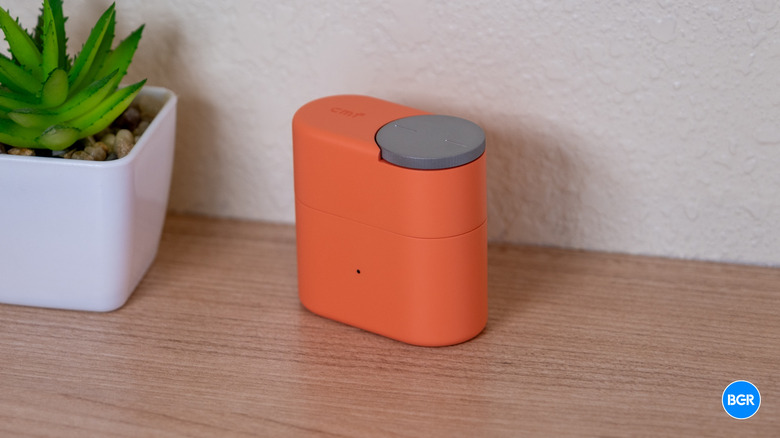 CMF Clip Pro earbuds in their charging case
