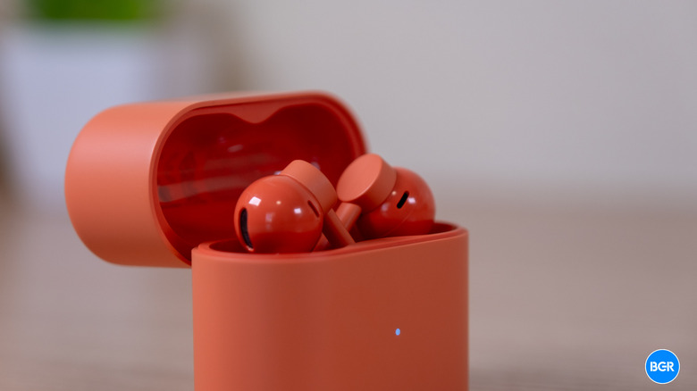 CMF Clip Pro earbuds in their charging case