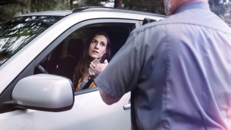 a woman getting a speed ticket