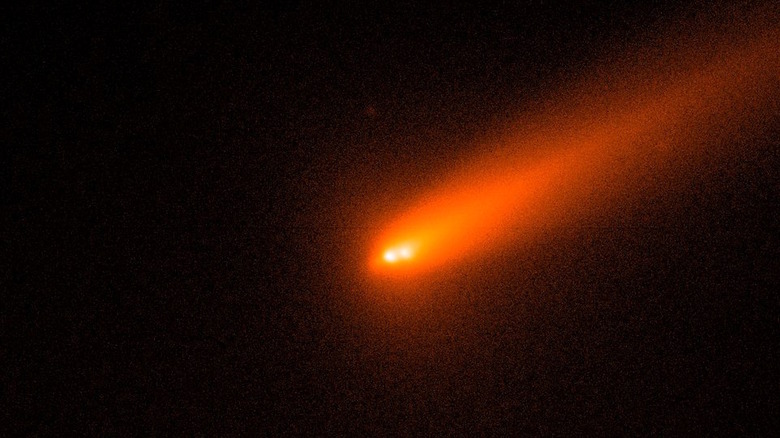 Close up of comet C/2025 K1 ATLAS splitting into three fragments in space