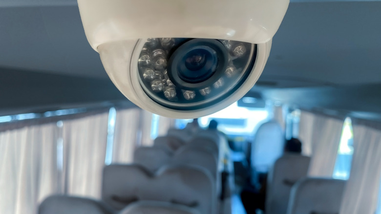 A surveillance camera mounted inside a public bus