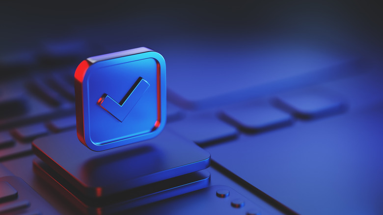 3D checkmark icon hovering above a keyboard.