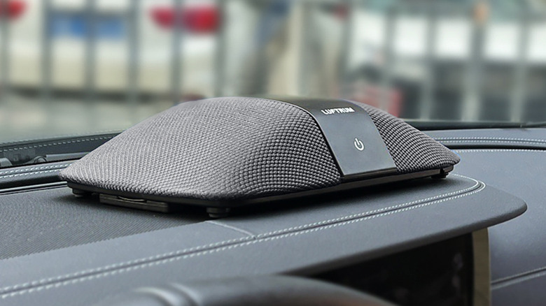 LUFTRUM Car Air Purifier placed on the upper dashboard.