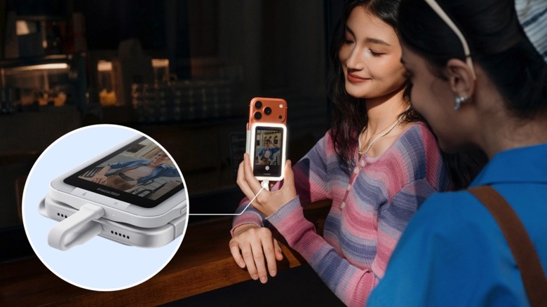 The Insta360 Snap in use, with a zoomed-in view of the USB-C cable connected to the iPhone