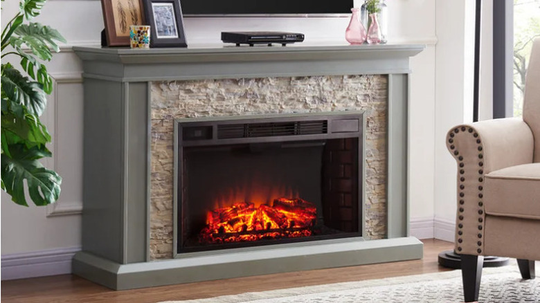 Costco Ledgestone Electric Fireplace in a living underneath a television screen