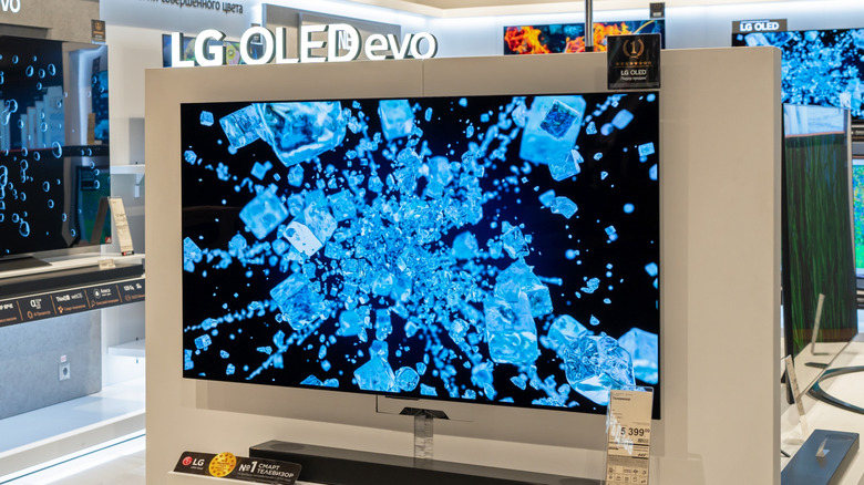 An LG OLED TV being showcased displaying blue ice with a black background