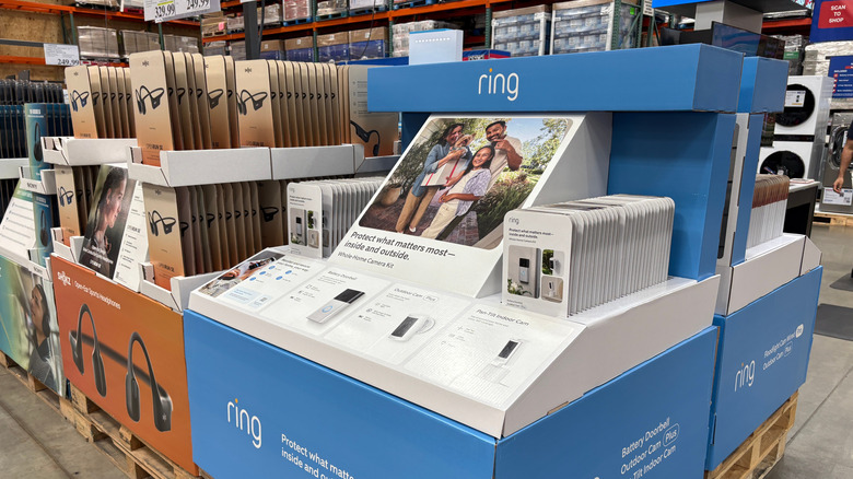 Various electronics on display in a Costco warehouse.