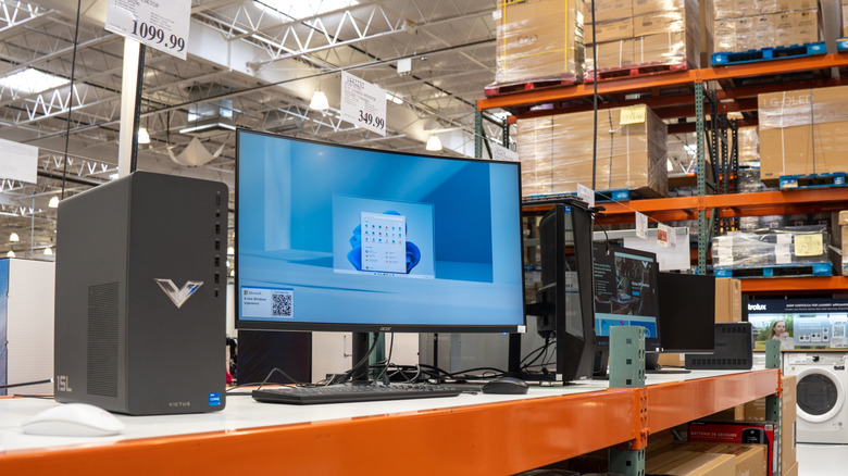 Prebuilt PCs and computer peripherals sit atop a Costco display counter