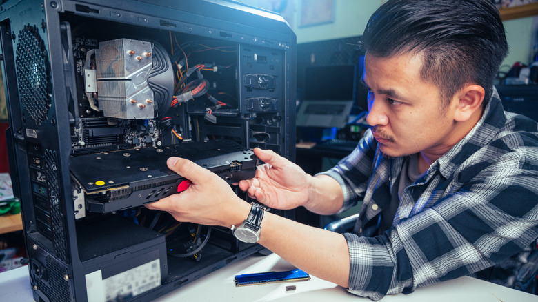 Person upgrading their internal PC components