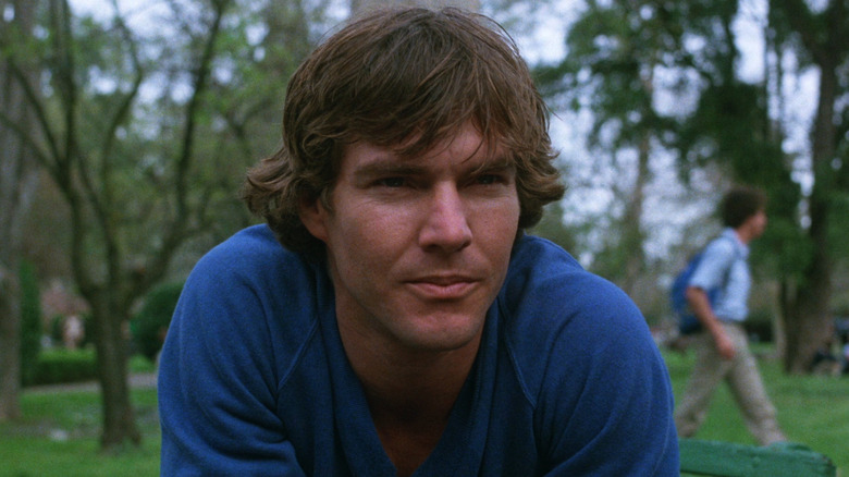 Alex (Dennis Quaid) hunched over in 