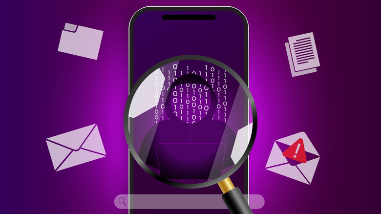 A phone magnifying glass shows a hooded figured and binary code on blank phone screen with emails, documents, and folders clearly on display.