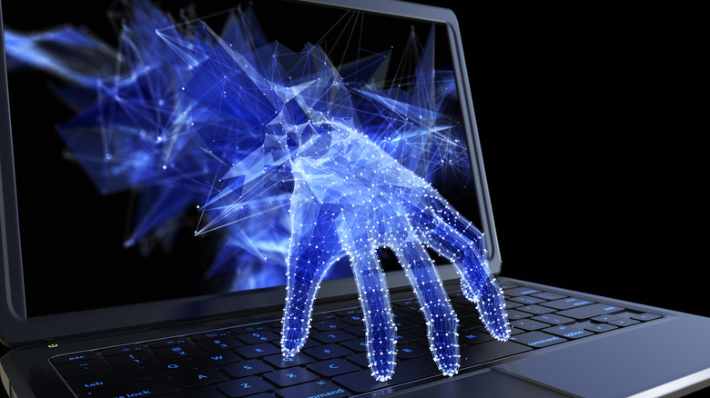 A cyber hand reaches through a pixelated laptop screen, symbolizing a cybersecurity hack.