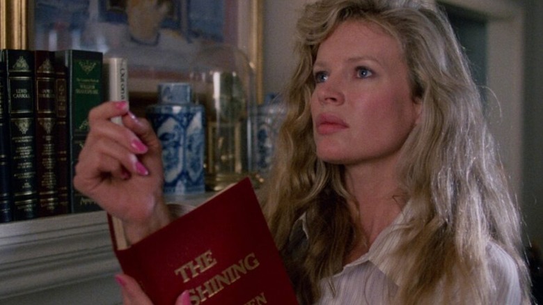 Celeste holding book of The Shining in her hand