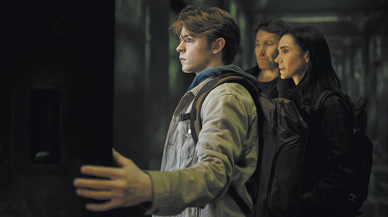 The Dessen family inside the box, opening the door to an alternate world