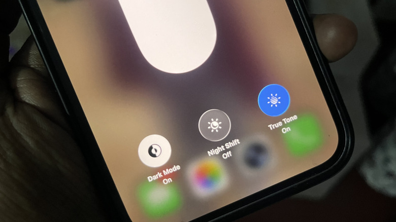 Brightness options like Dark Mode, Night Shift, and True Tone on iPhone