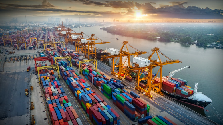 A maritime port where ships are docked and freight containers are stacked high