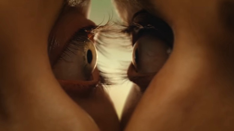 Tim and Millie's eyeballs begin to morph together in an iconic scene from "Together."