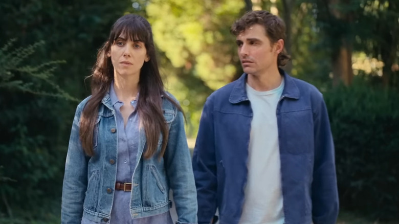Millie and Tim walk through the woods together