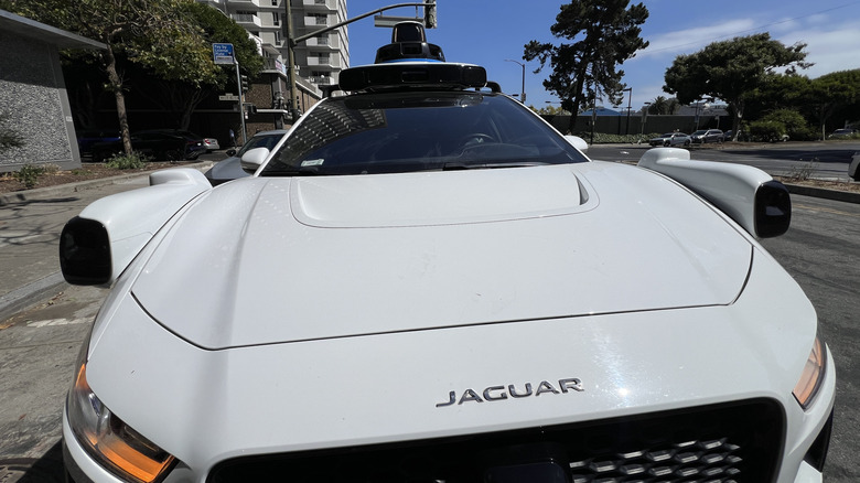 A wide-angle view of a Waymo Jaguar vehicle in San Francisco.
