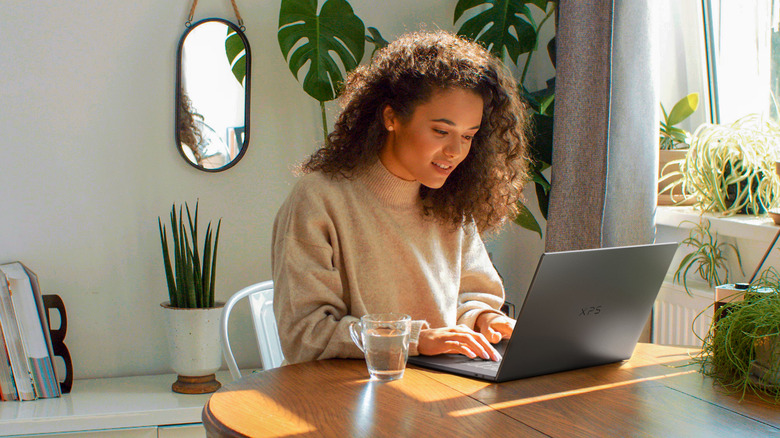 A person using a new Dell XPS laptop