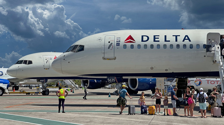 Passengers boarding a Delta Air Lines plane.