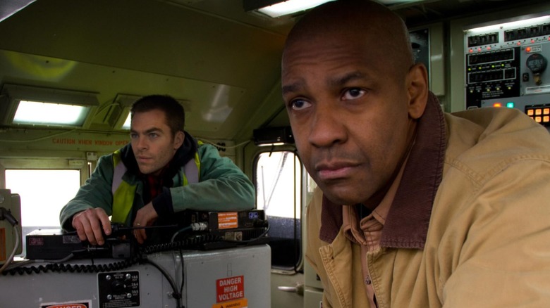 Denzel Washington in the film "Unstoppable," the actor is starring off into the distance while he stands in what appears to be a control room