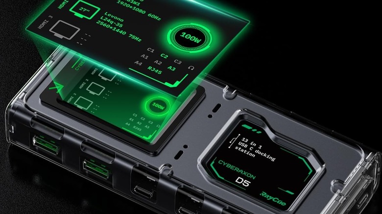 Futuristic looking docking station with screen and green glow on a black background