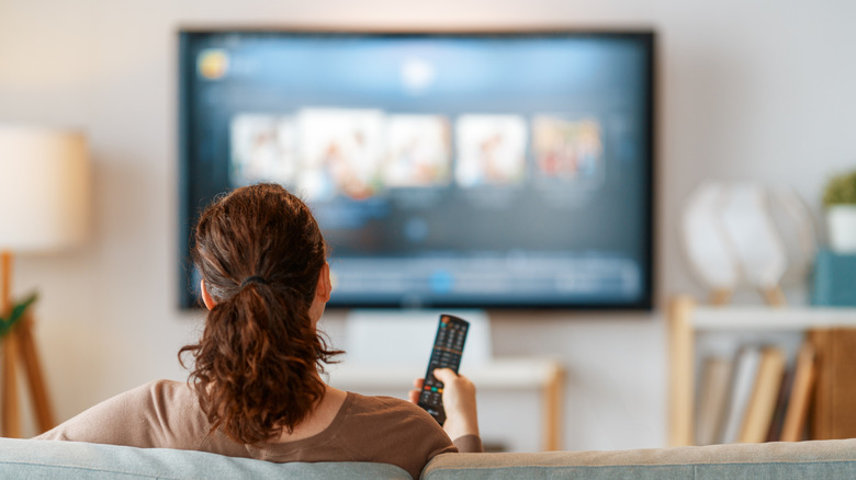 Person watching TV on a couch