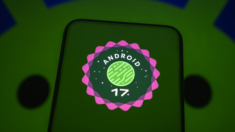 Android 17 logo on the screen of a smartphone, with the Android logo in the background.