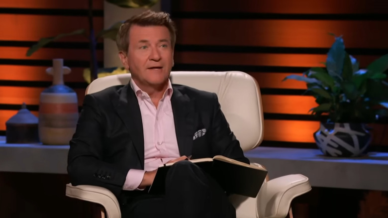 Robert Herjavec sitting in the Shark Tank waiting for the next contestant.