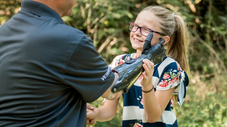 A parent touching their child using a Psyonic Ability Hand