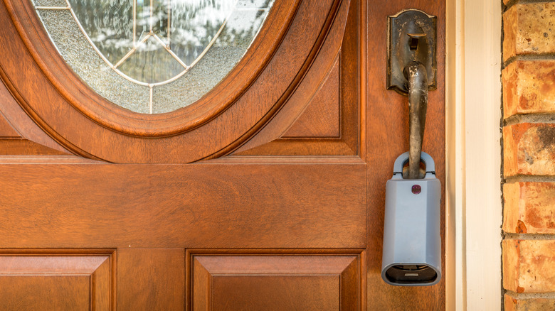 A lockbox on the front door of a house