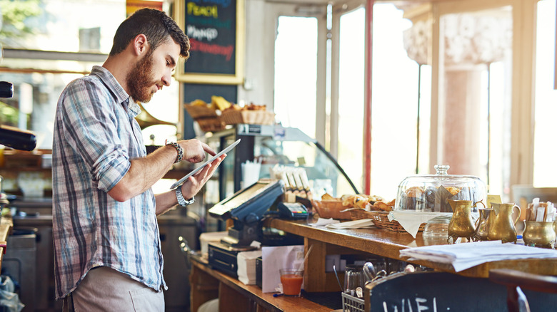 A man using an app in a small business