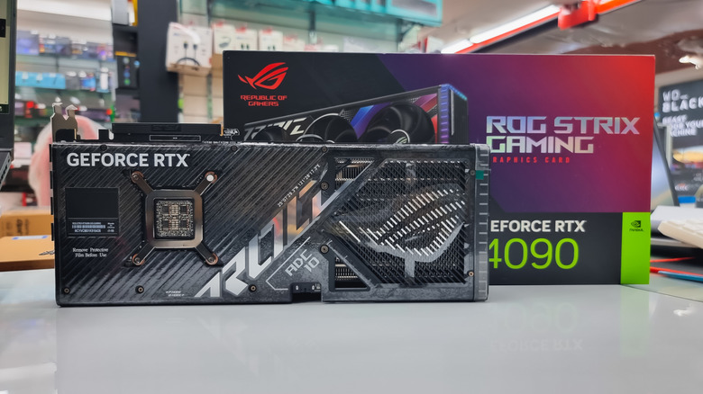 ASUS ROG Strix GeForce RTX 4090 graphics card displayed in front of its retail box.