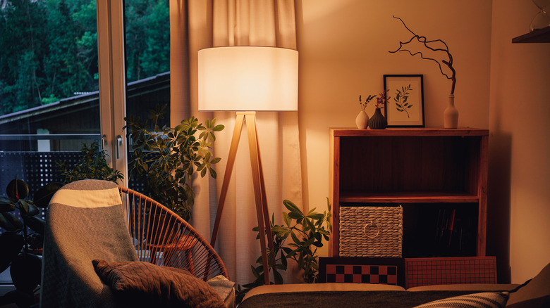 A cozy lamp illuminating a living room.