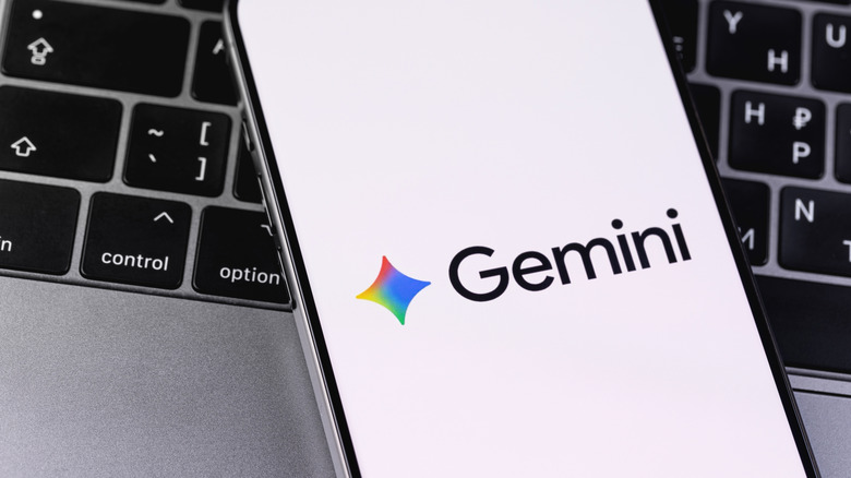 Google Gemini logo mobile app on a screen smartphone iPhon