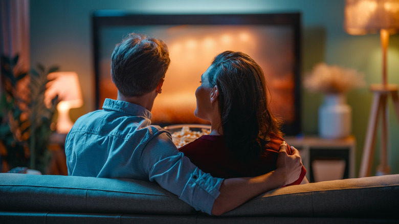 a couple watching TV together