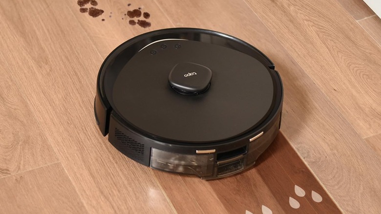 The Tapo RV30 Max Plus uses its mopping feature on hardwood floors.