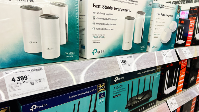 A few TP-Link routers for sale at a retail outlet.