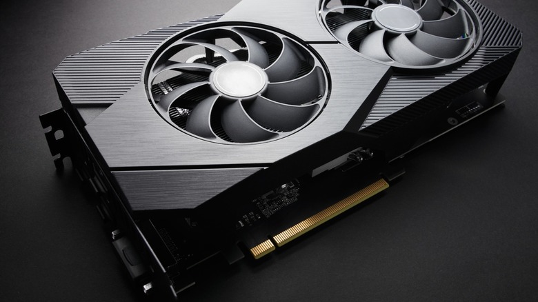 Nondescript graphics card in all-black with a dark background.