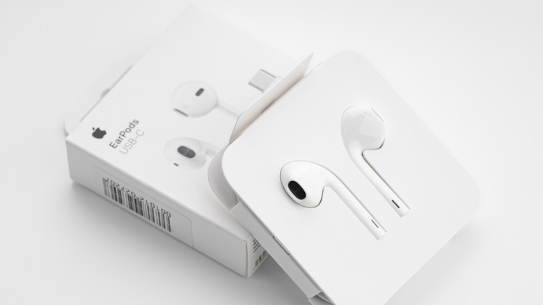 Apple EarPods in their original case on a white background.