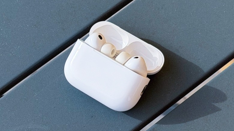 Close-up shot of AirPods Pro 3 on their charging case