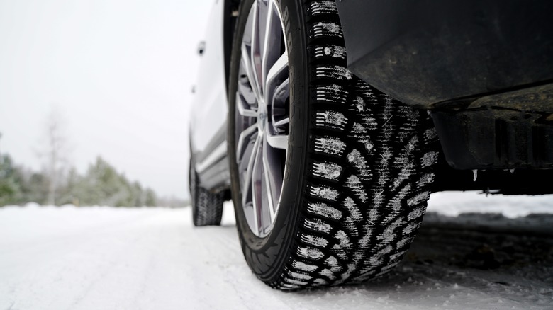Winter tires on a snowy road.