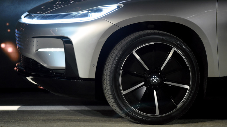Prototype EV crossover with close up of tire.